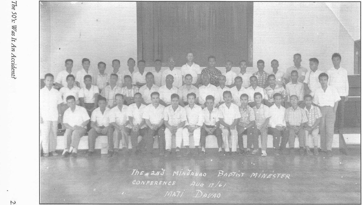 Rows of ministers seated and standing for a conference group portrait in Mati, Davao.
