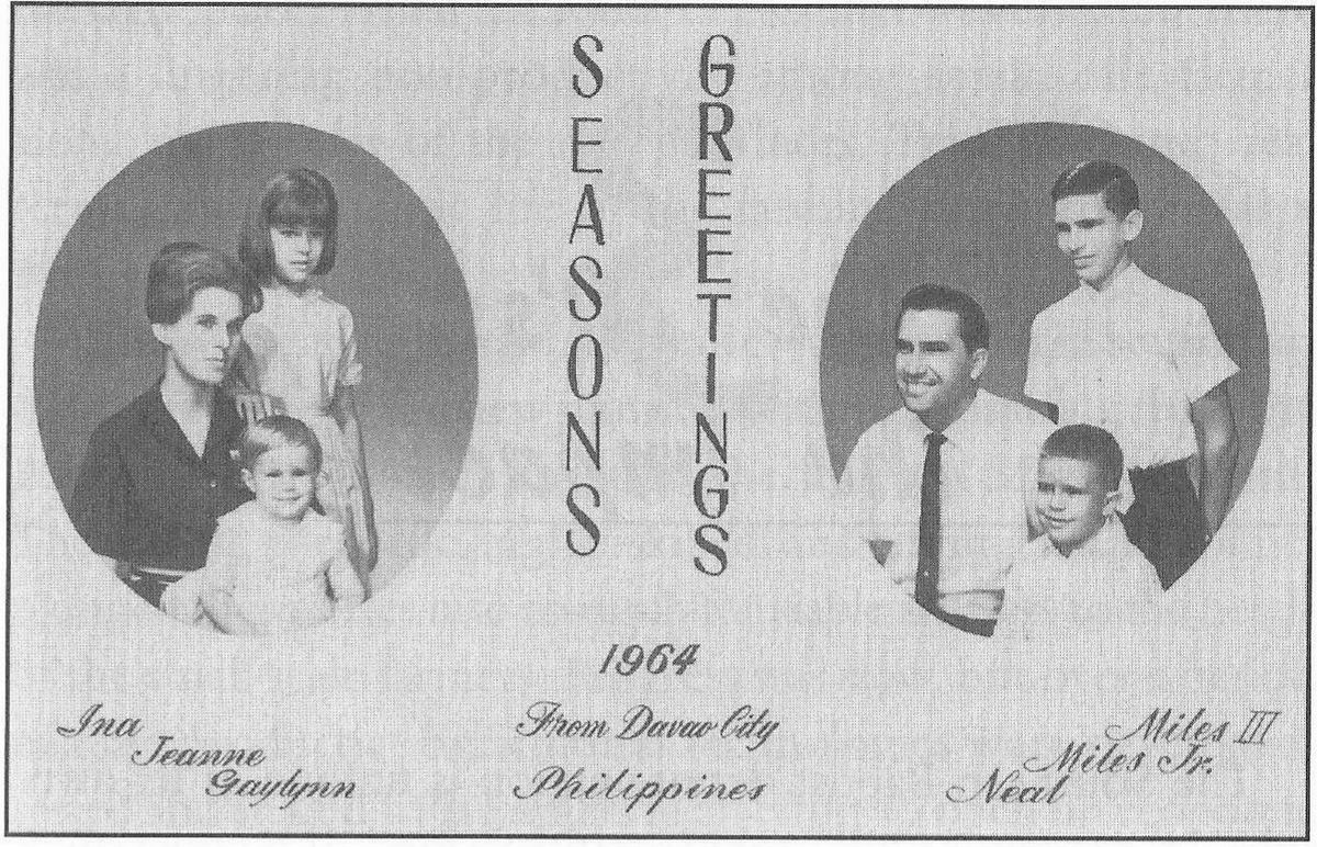 Printed Christmas card with two oval family portraits and the words Seasons Greetings.
